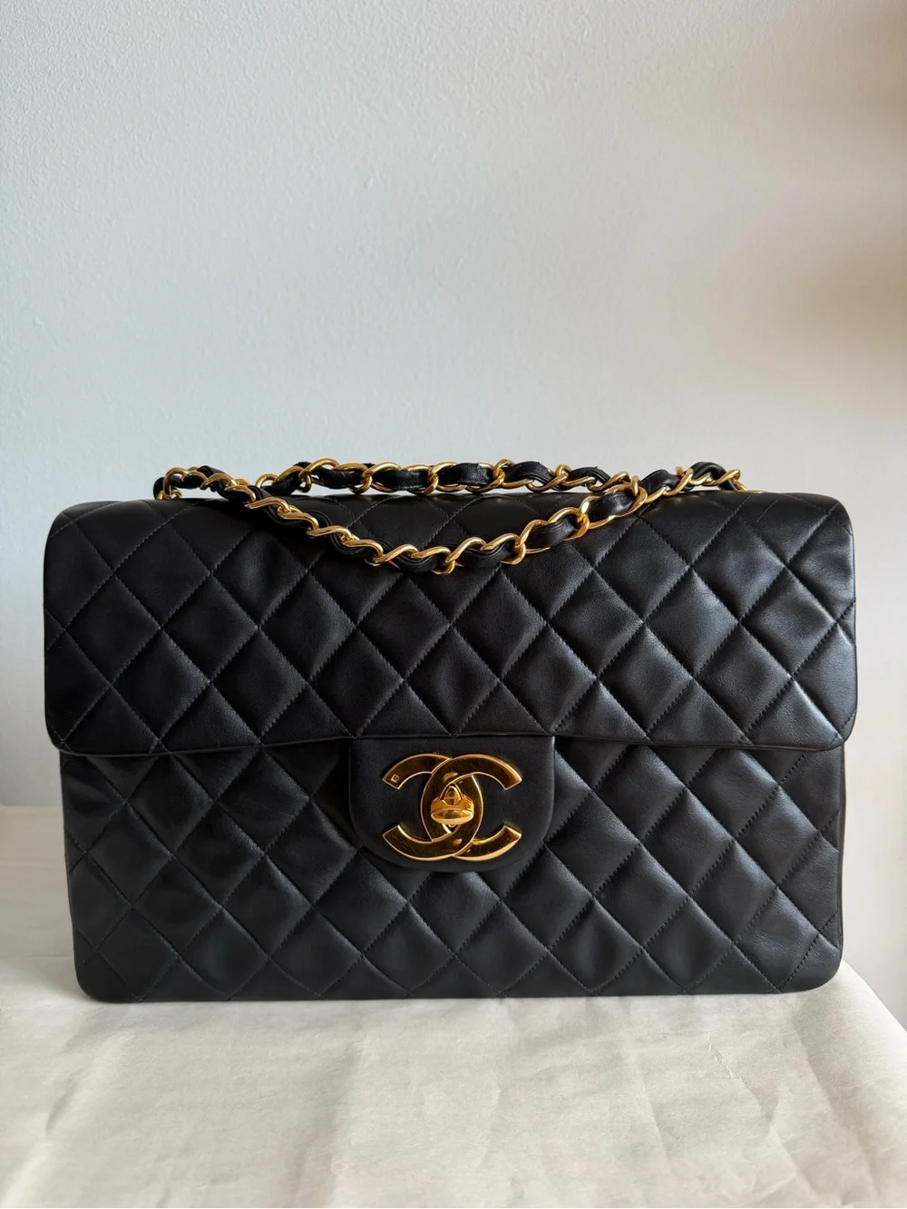 CHANEL Black Quilted Shoulder Bag with Gold Chain & CC Lock